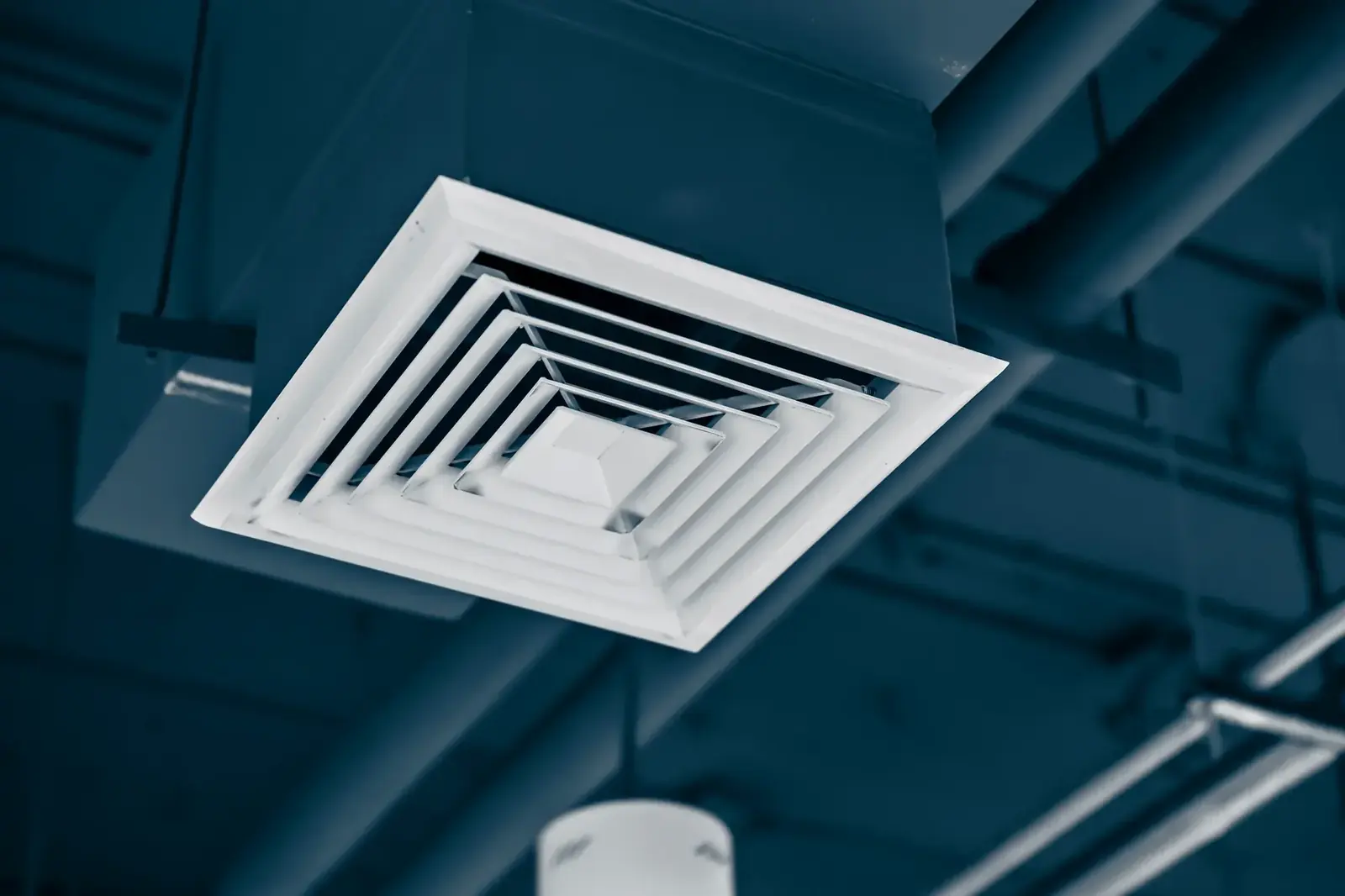 Commercial ceiling diffuser and ductwork after professional cleaning